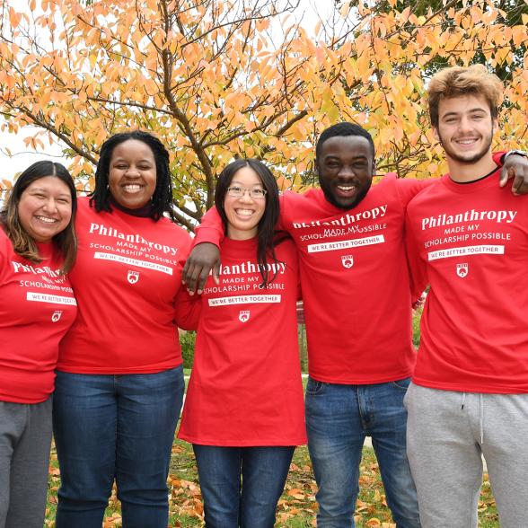 Group photo of students with red shirts that read "Philanthropy"
