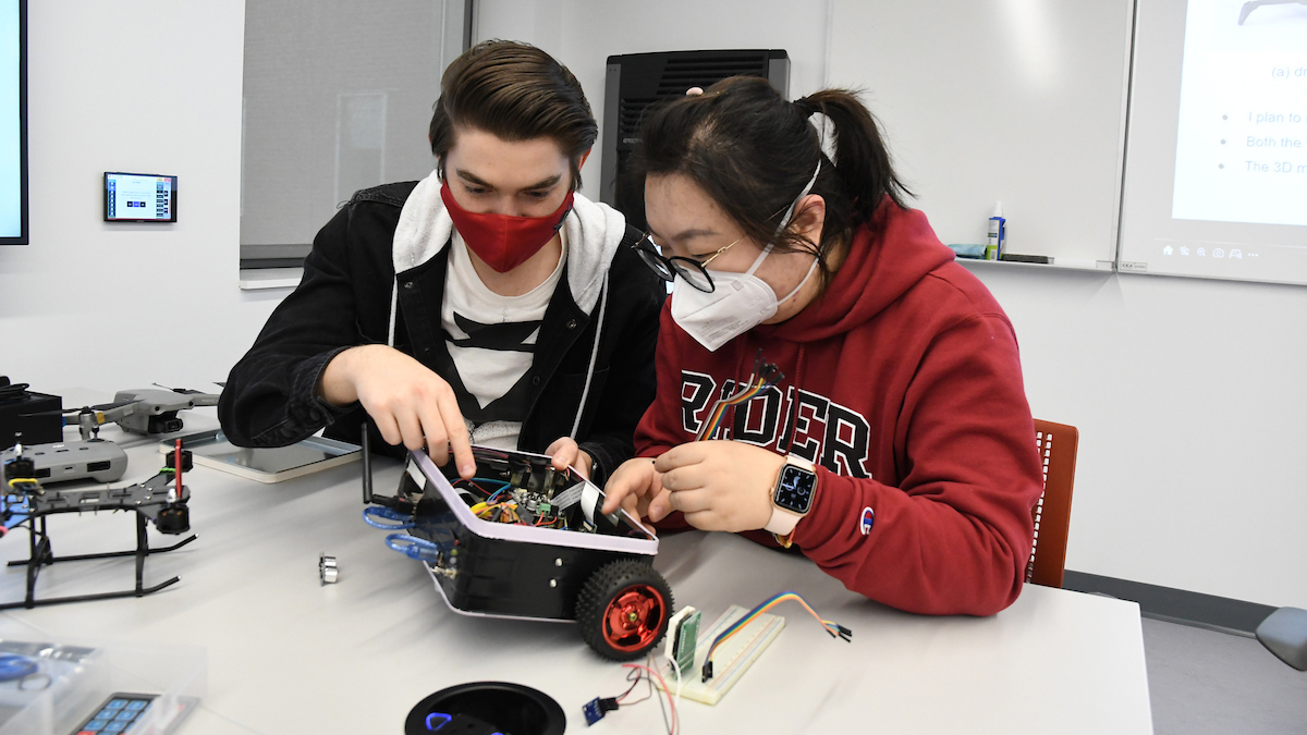 Students work on robotics kit