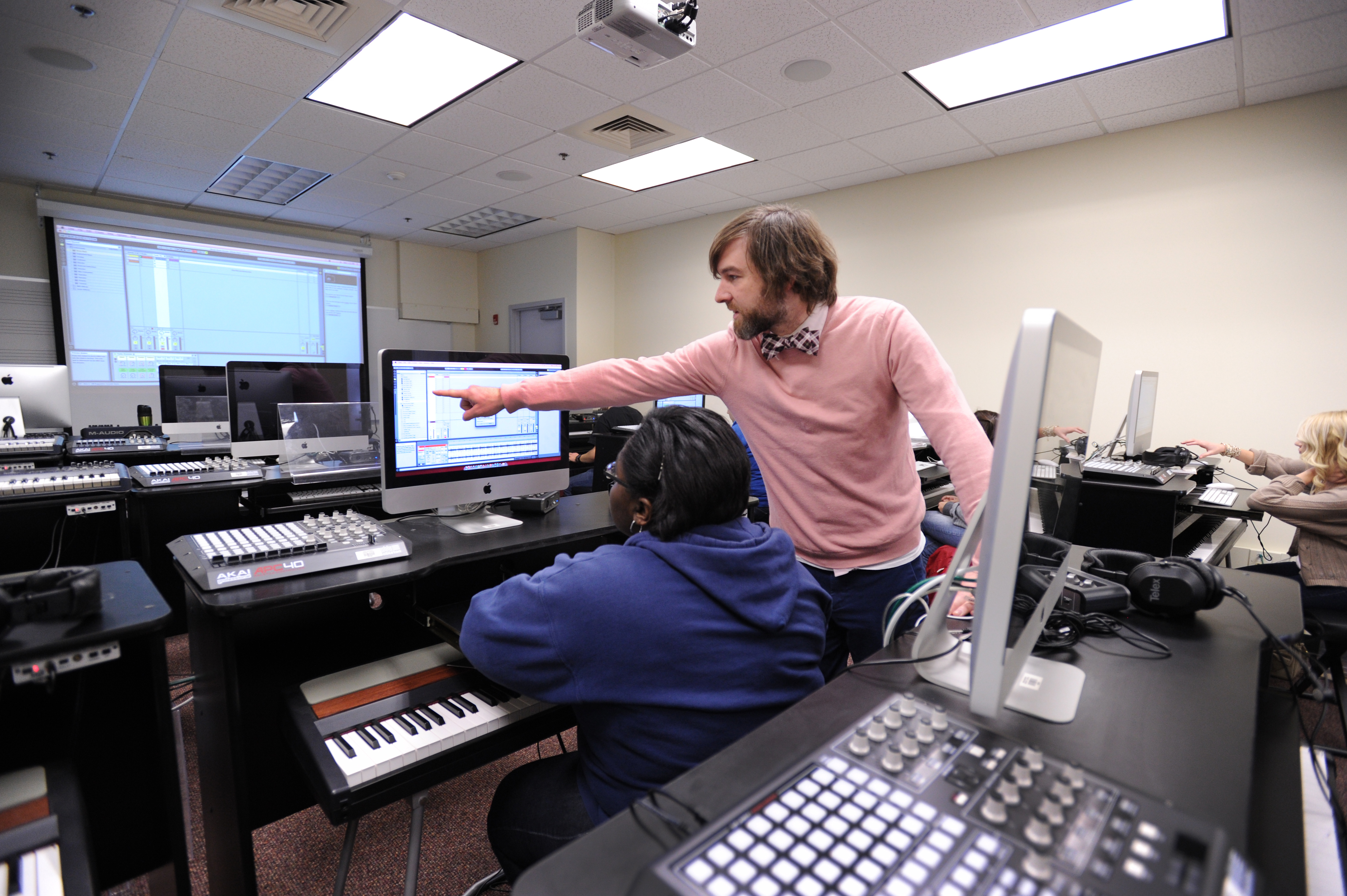 Professor points to computer of student