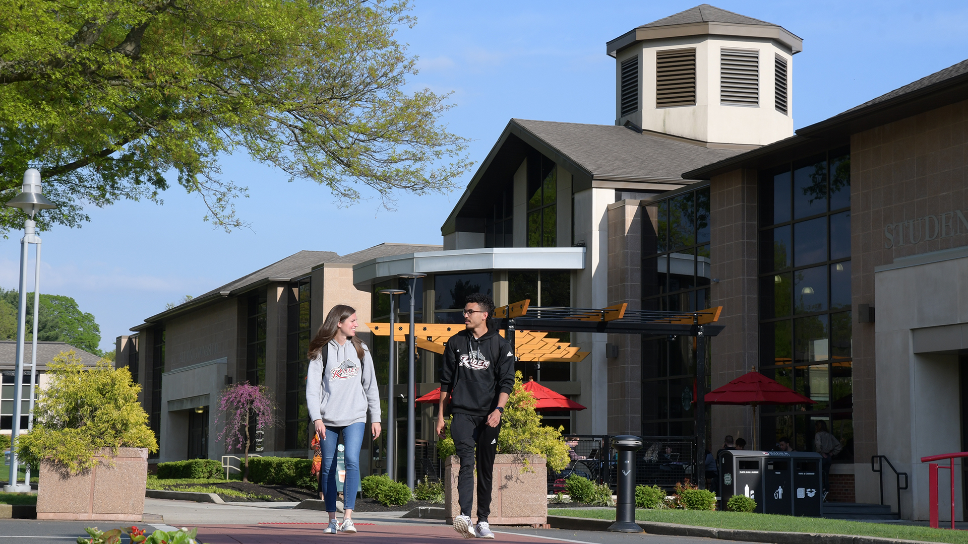 Two students walk near Student Recreation Center
