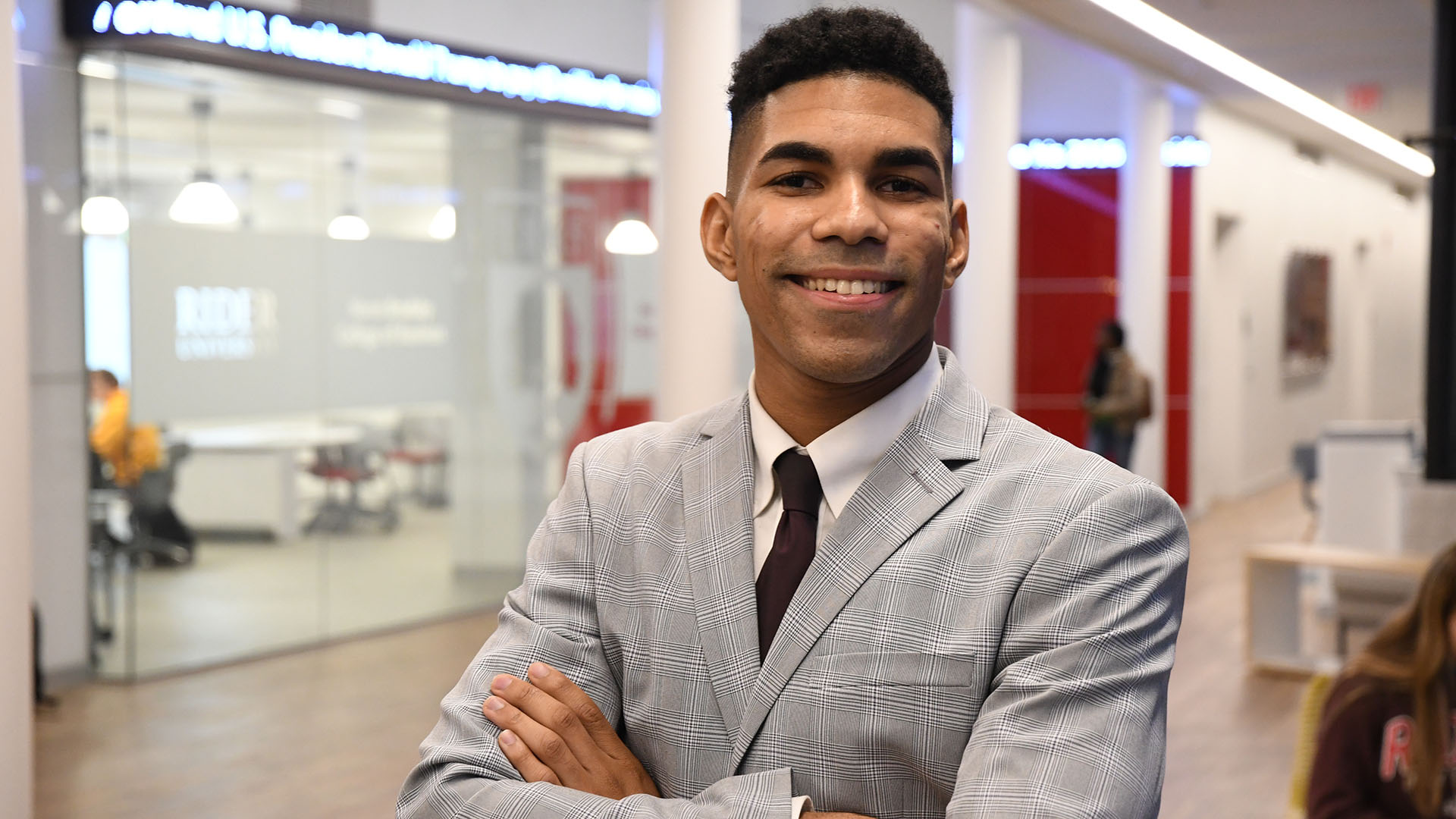 Business student with arms crossed