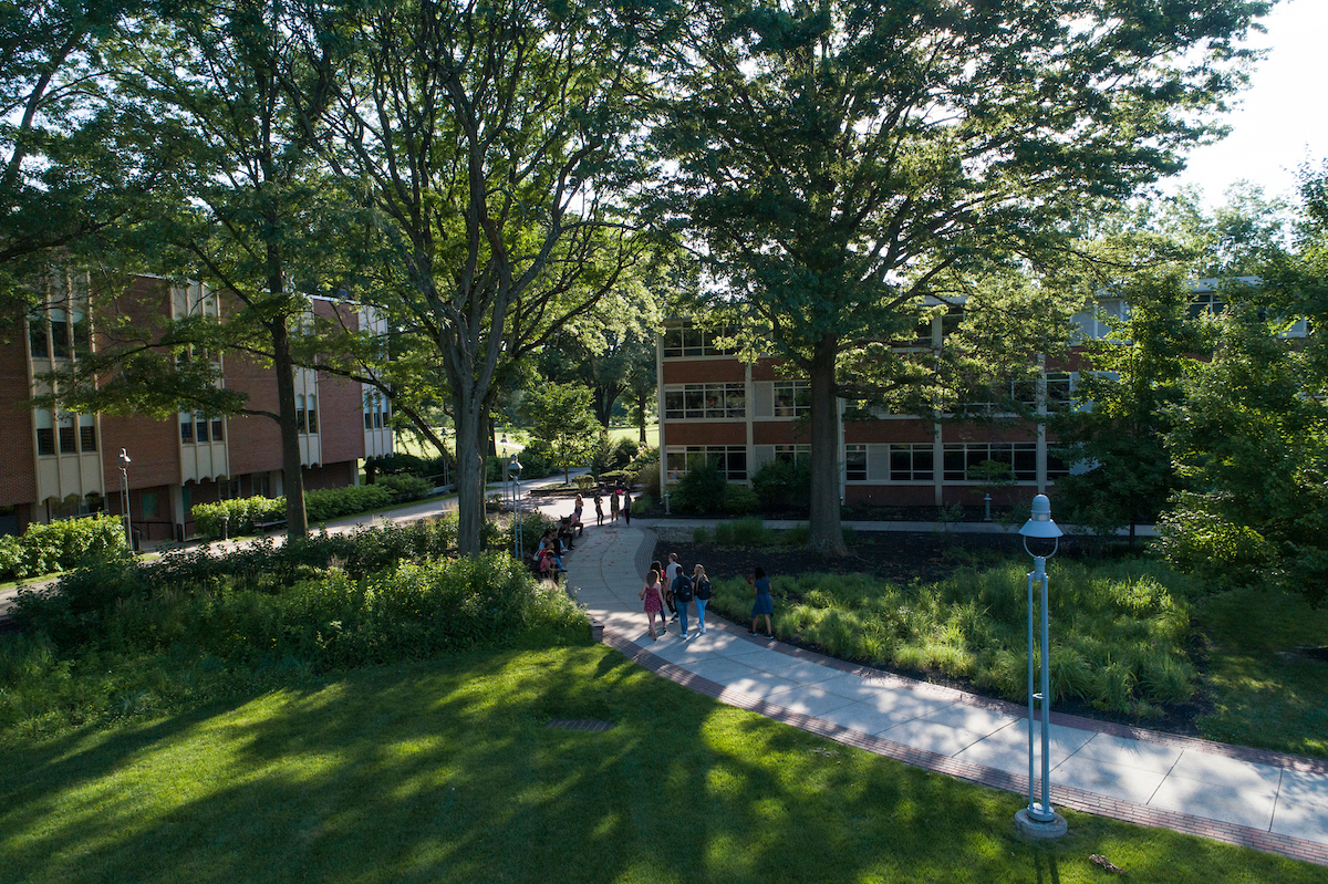 Students walk through academic quad