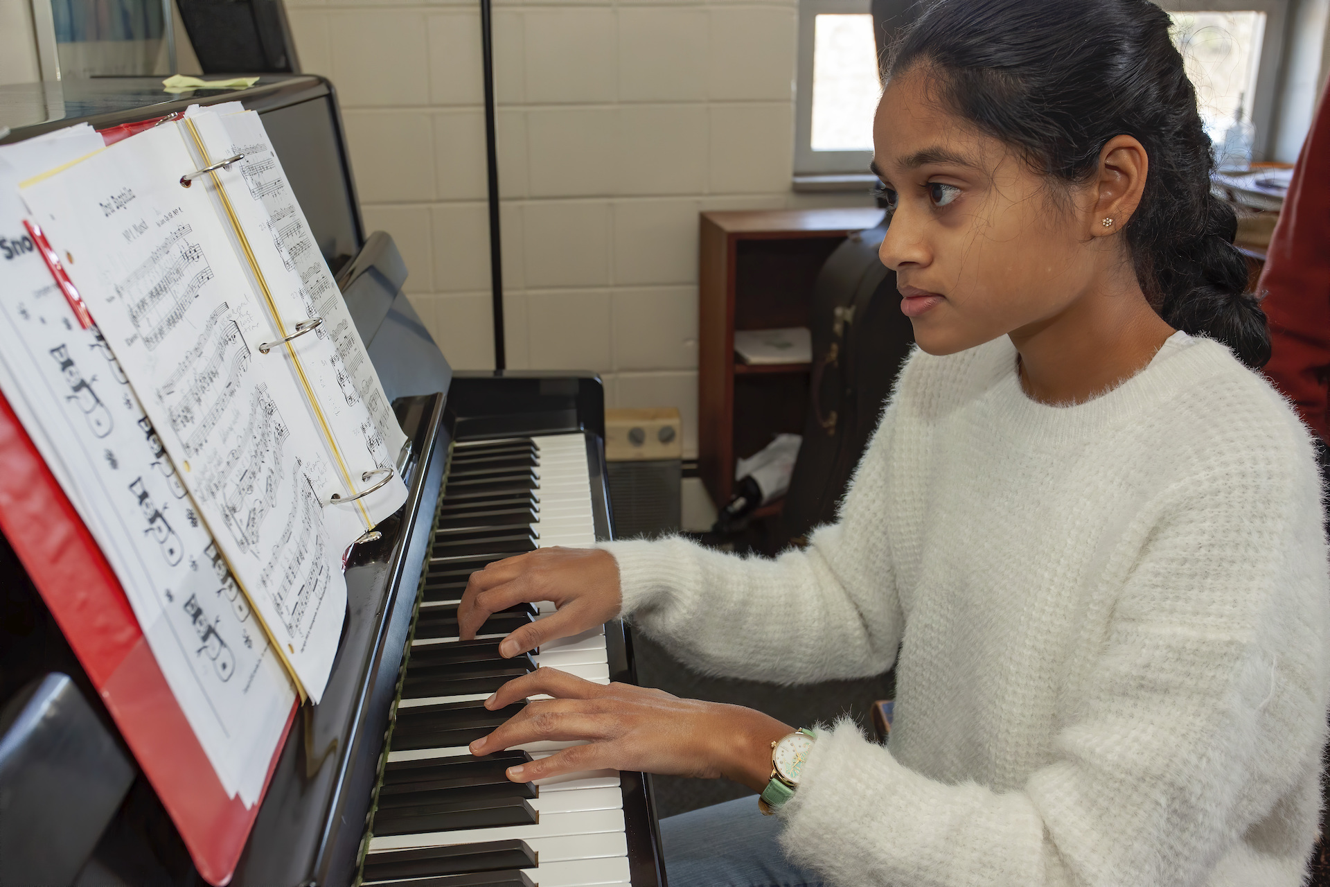 Student playing piano