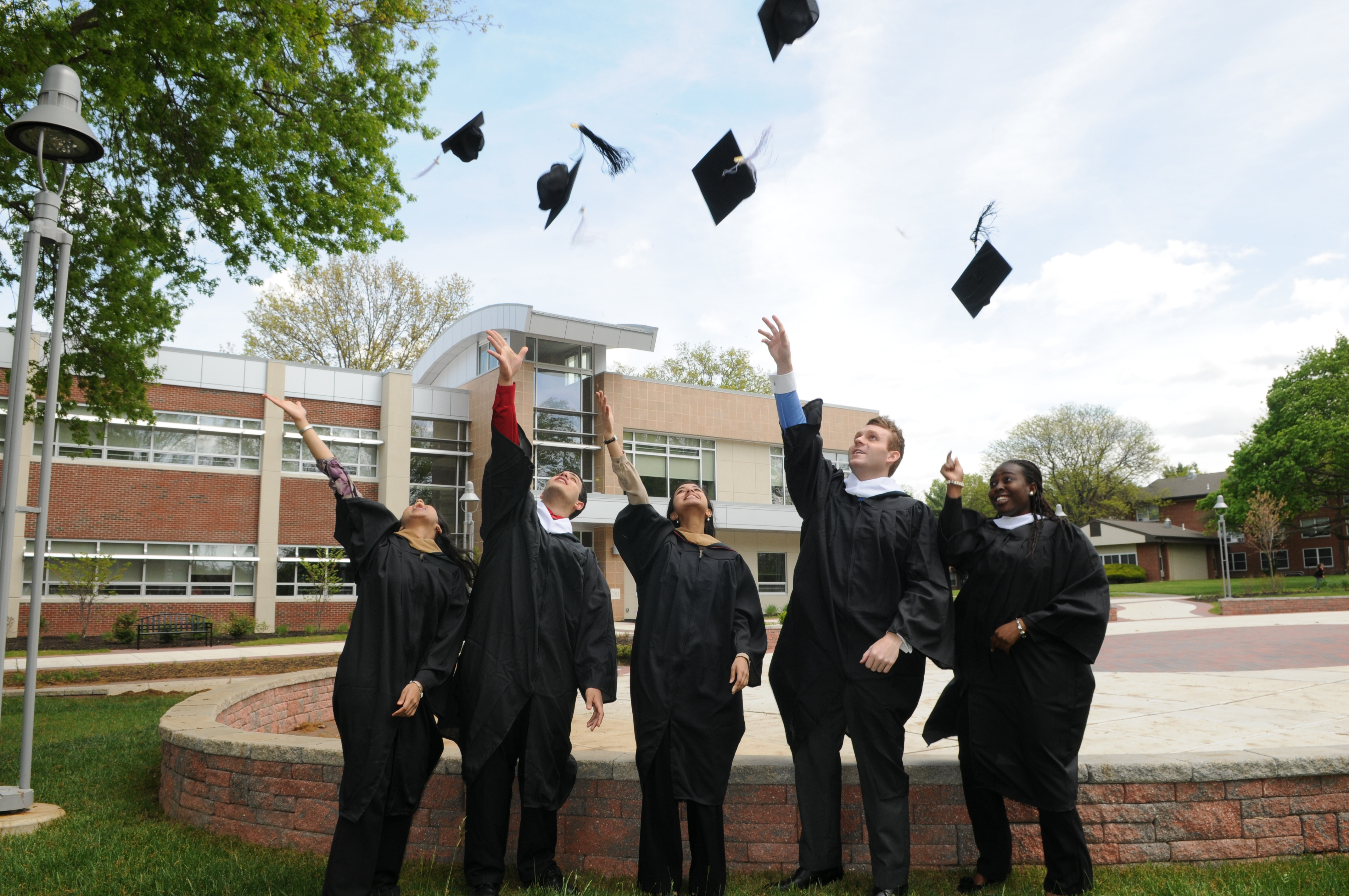 Rider graduates toss their caps at commencement