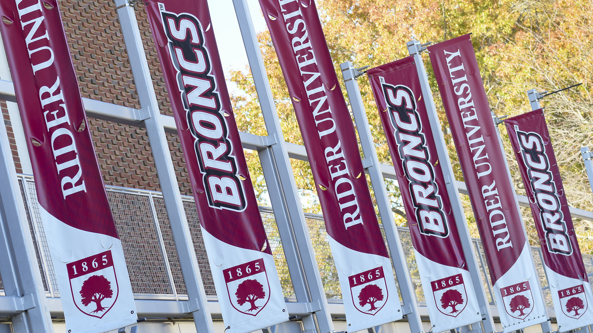 Rider flags outside the Bart Luedeke Center
