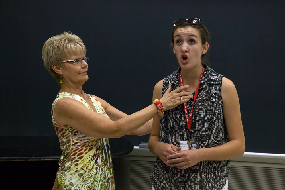 Faculty member teaches voice student.