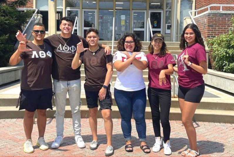 Multicultural Greek Council students pose outside of library