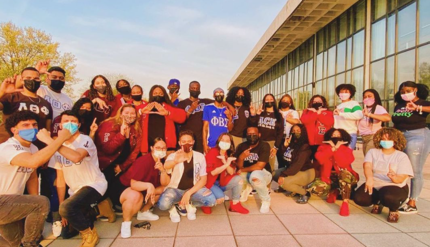 National Pan-Hellenic Council students pose for group photo outside of BLC