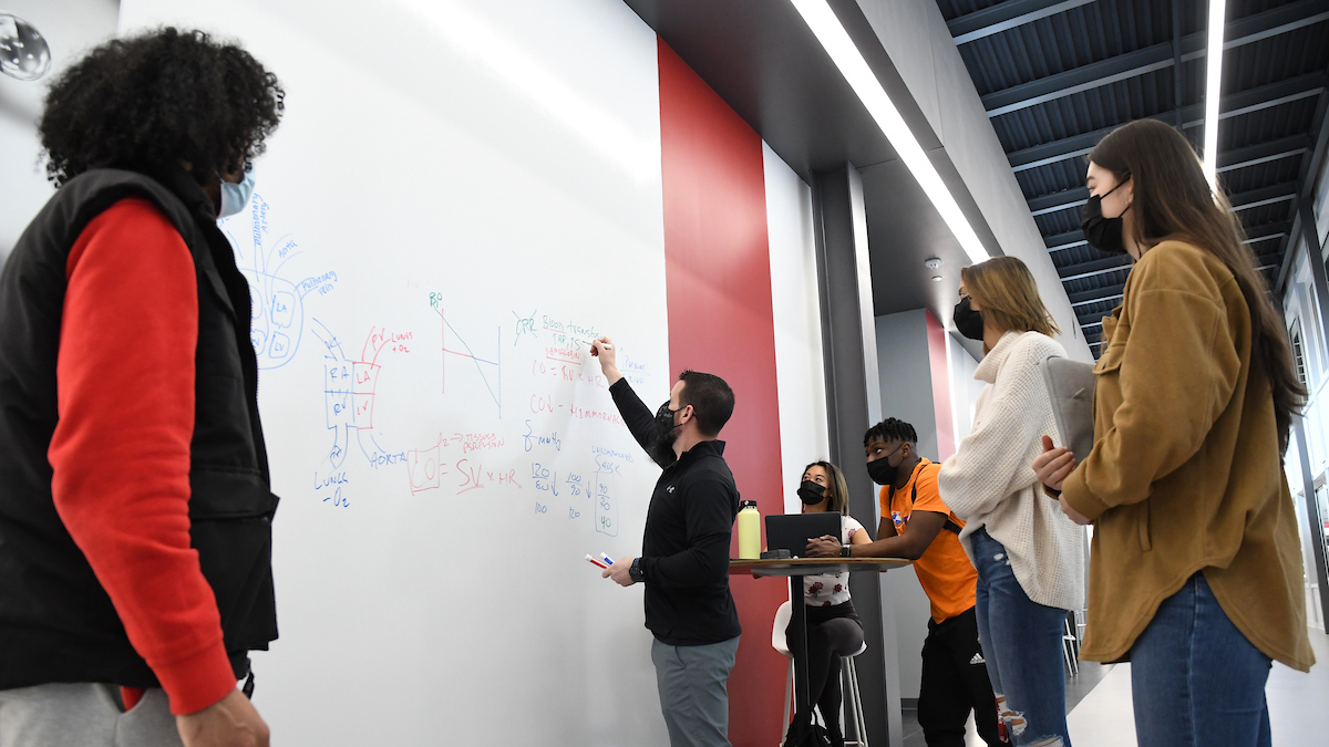 Students and faculty write on writable walls