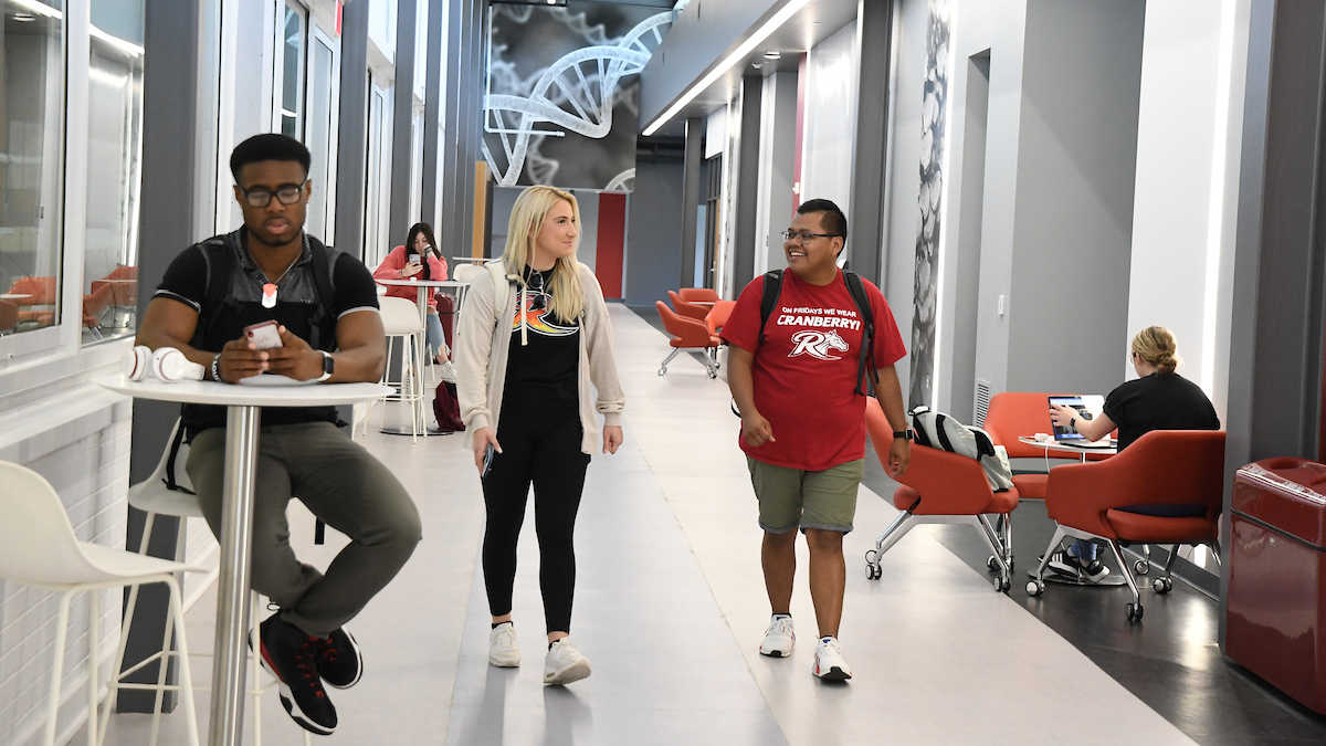 Students walking in new science building