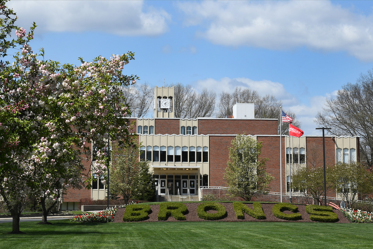 Moore Library in spring with flowering trees