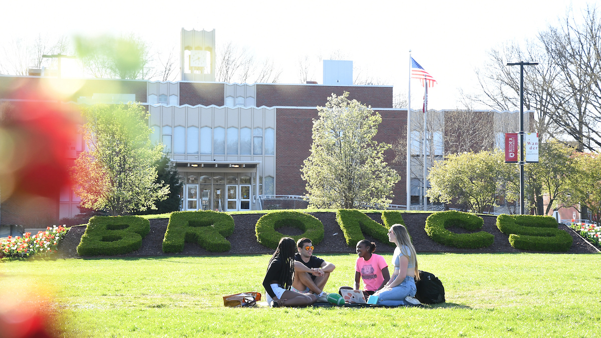 Students sitting on Campus Mall