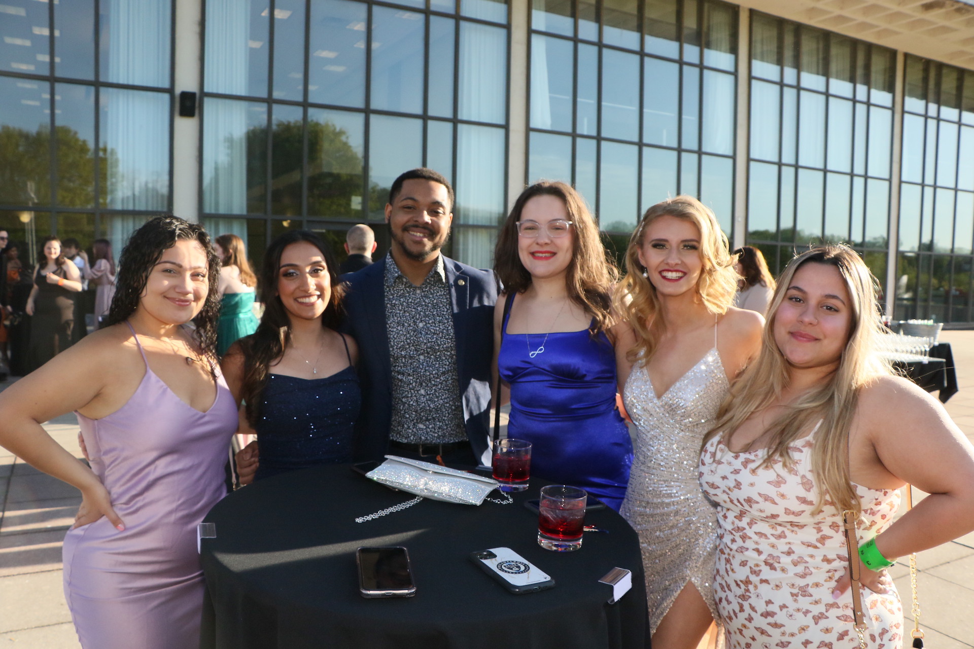 Group of alumni pose for photo