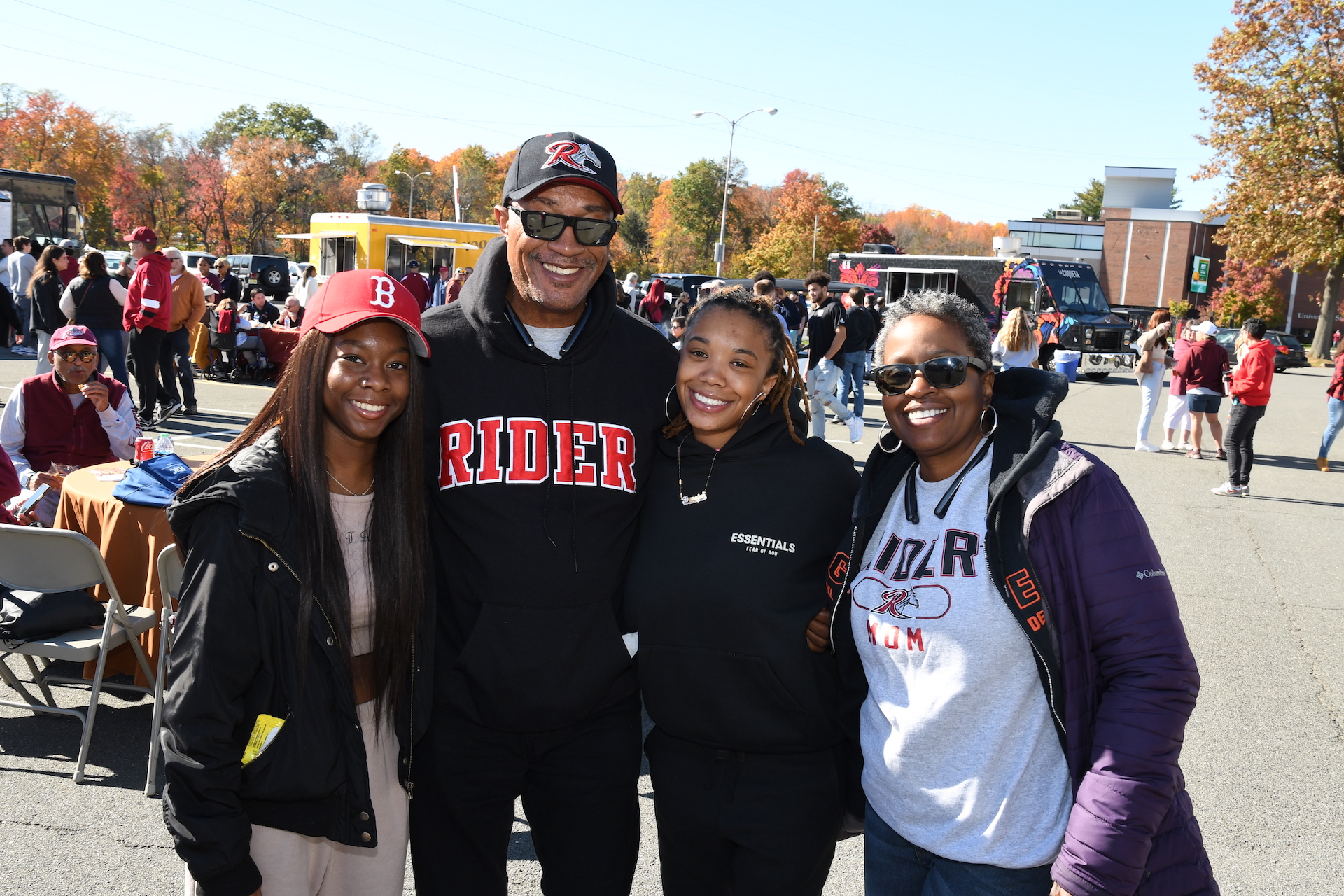 Family pose for photo at Homecoming weekend