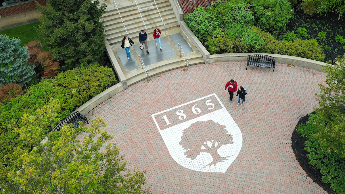 Students walking by library