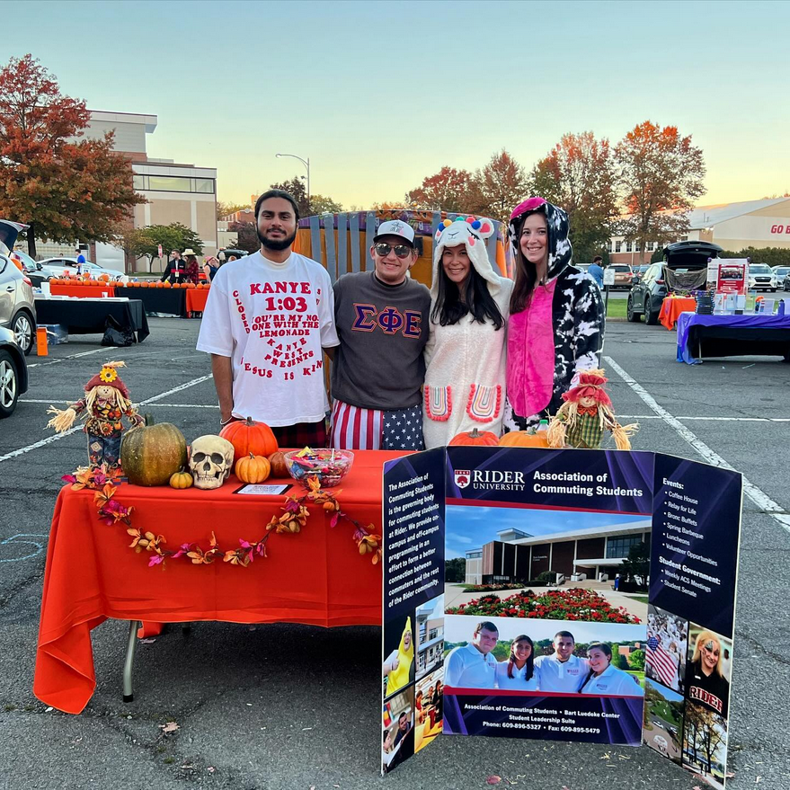 Members of the Association of Commuting Students represent the organization at the Scream Screen drive-in event.