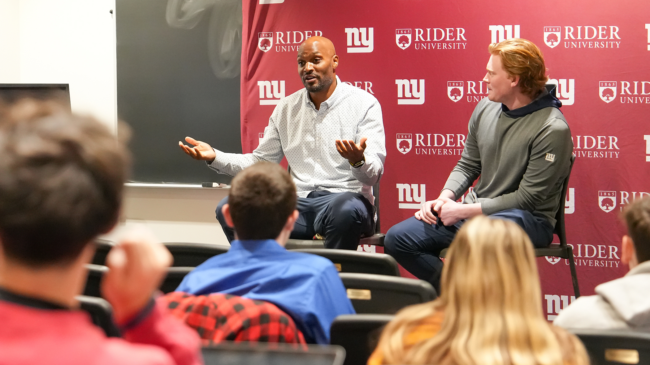 Amani Toomer speaking to Rider students