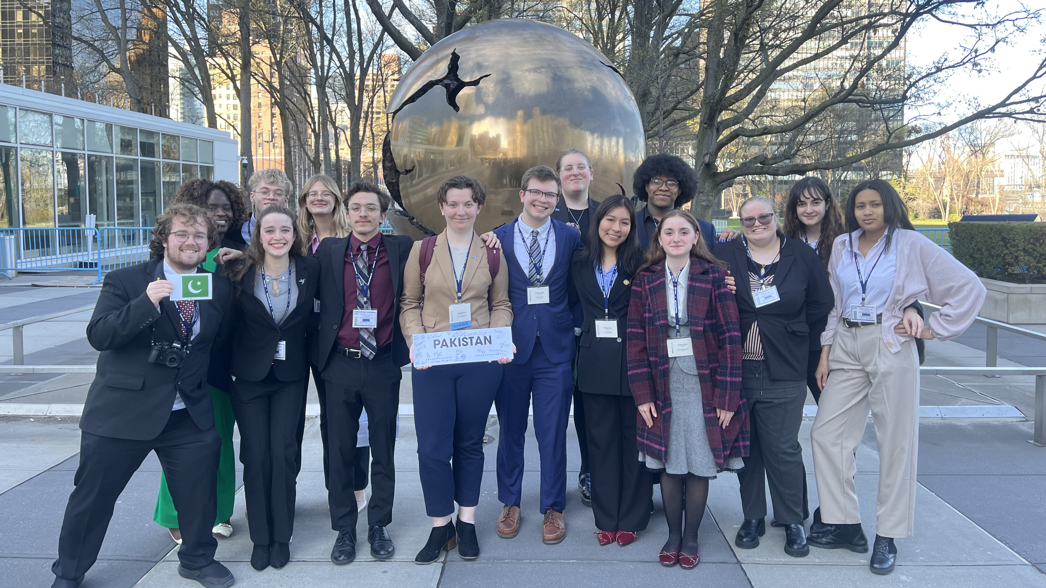 Model UN Students posing with sign