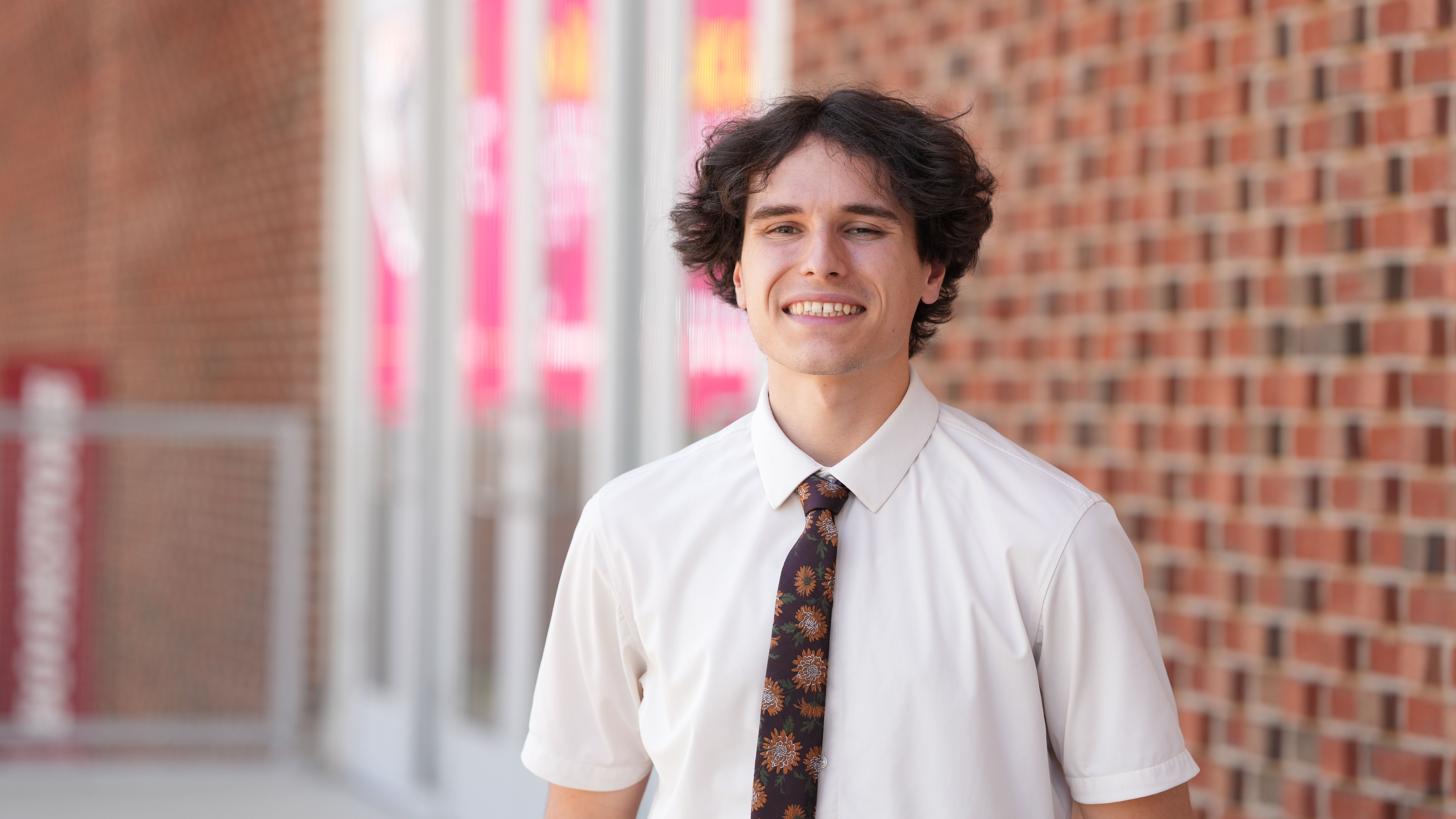 Jake Tiger poses for picture on campus