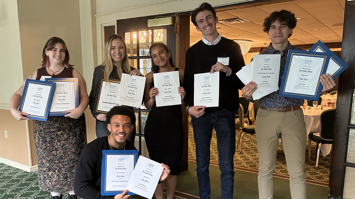 Rider News students posing with awards