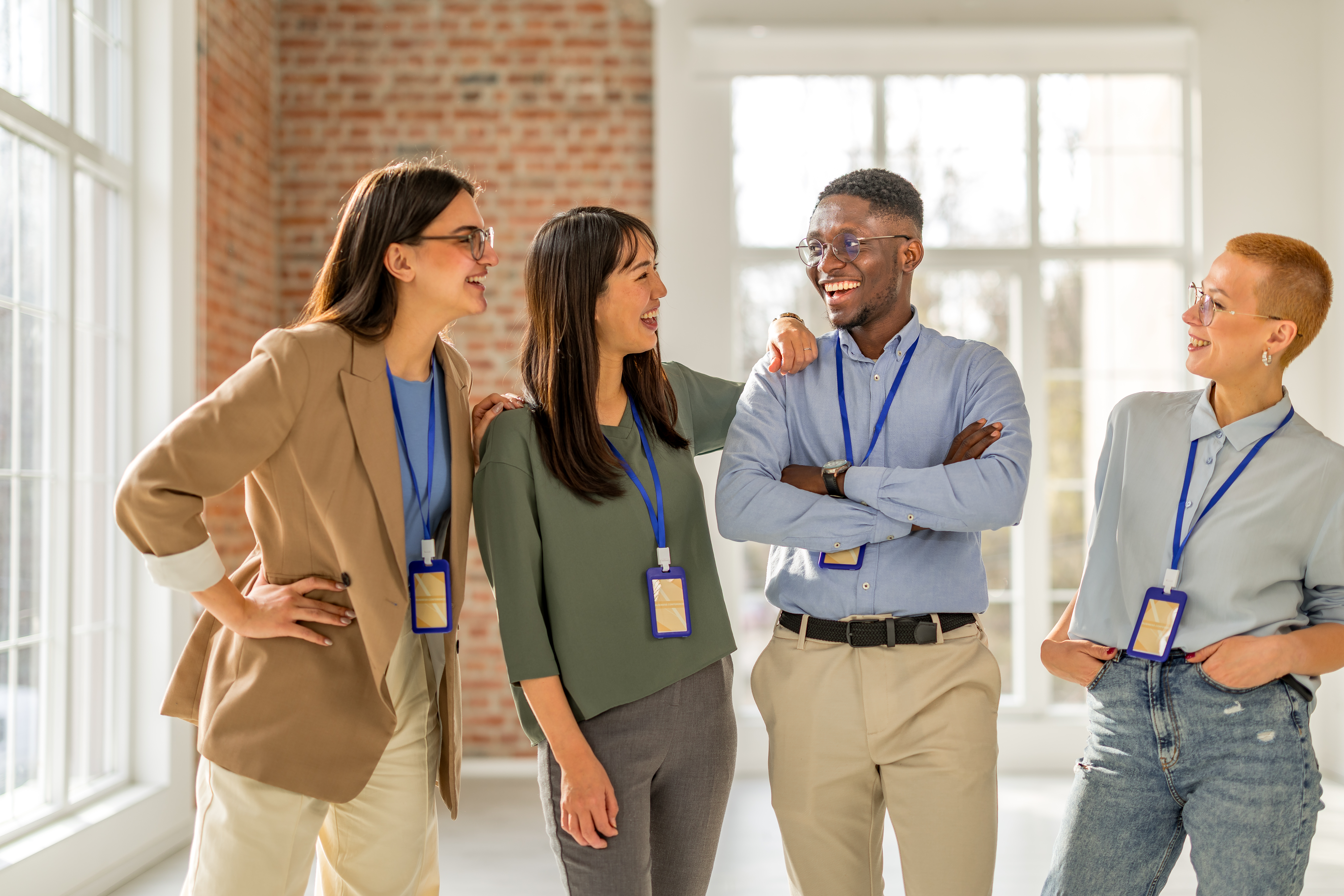 colleagues discussing and laughing in a group