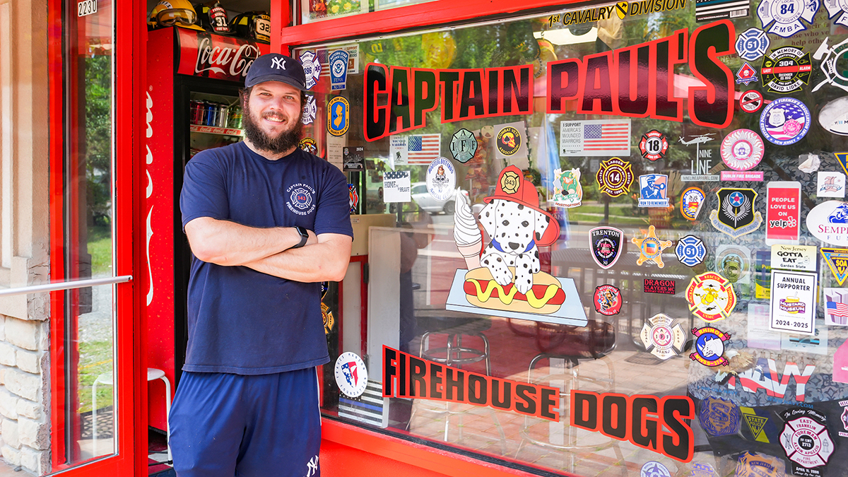 Patrick Jones standing outside Hot Dog store