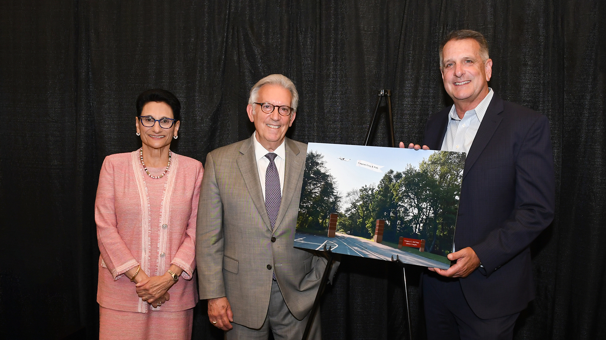Joan Mazzotti, Gregory G. Dell'Omo and Don Harnum standing by rendering of Athletic Complex