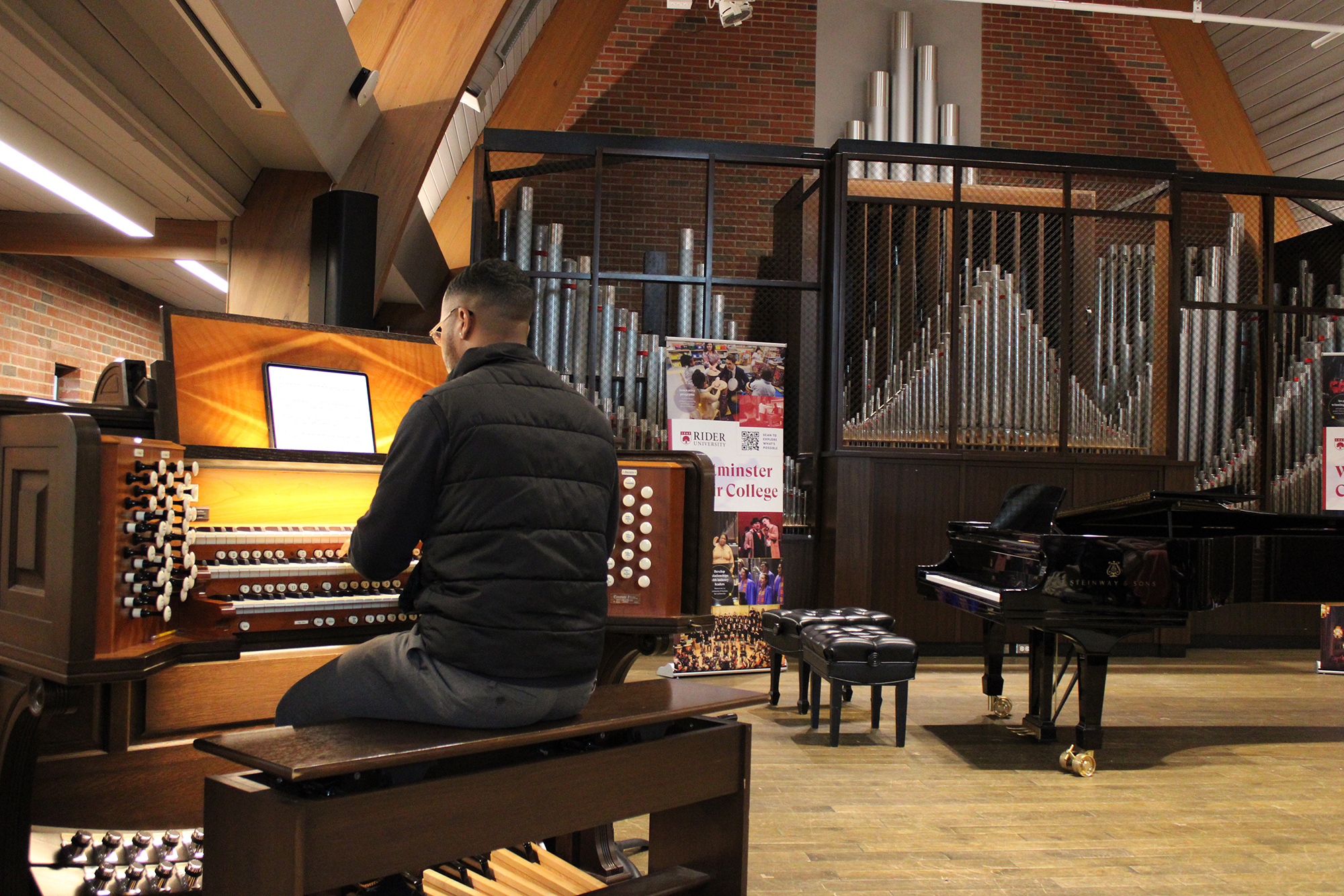 student playing the organ in Gill Chapel