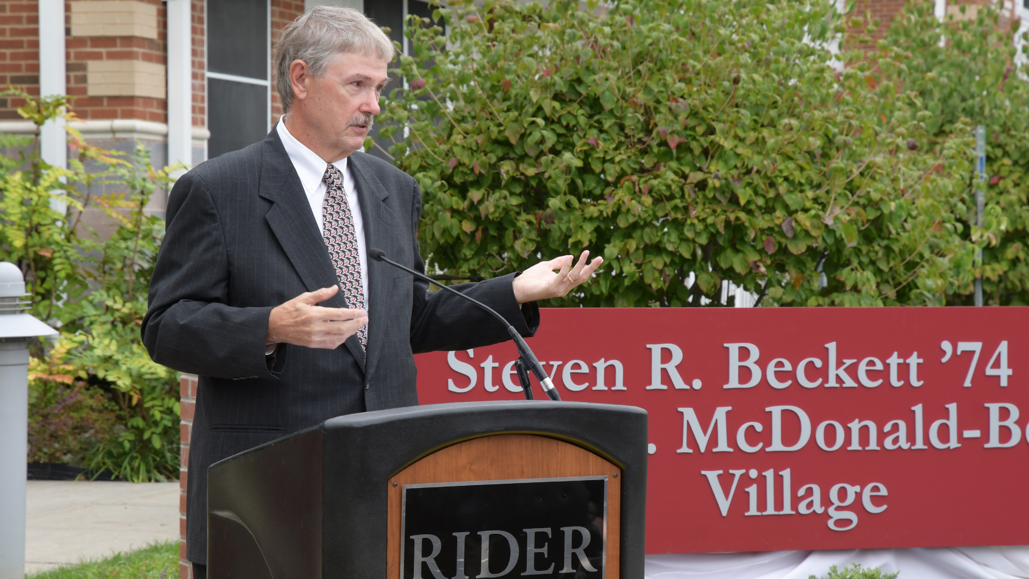 Steven Beckett speaks at ceremony