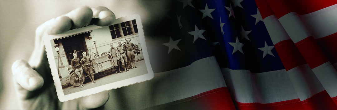 Photo of soldiers near American flag