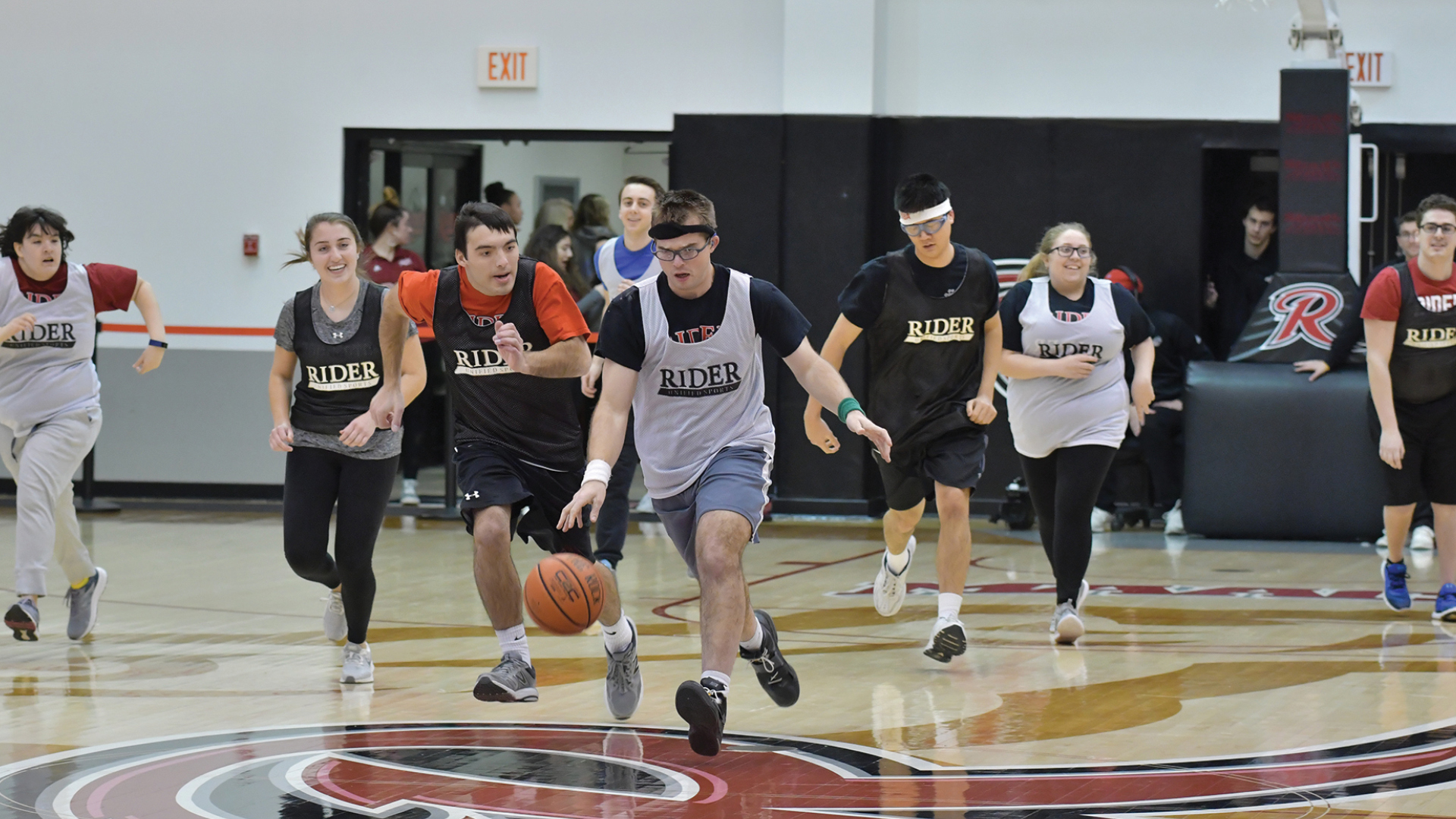 Rider United players play basketball