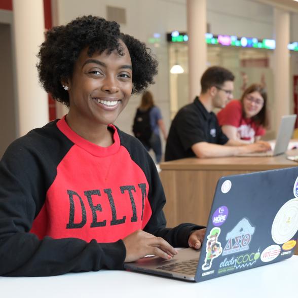 Student studying in Sweigart common area