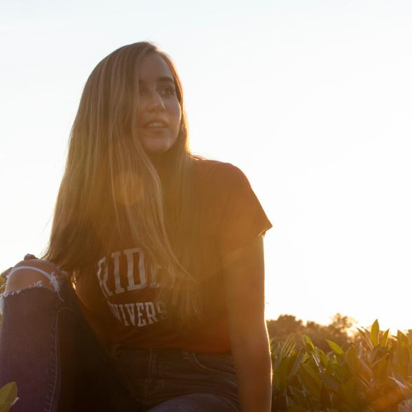 Student sits on Rider Rock