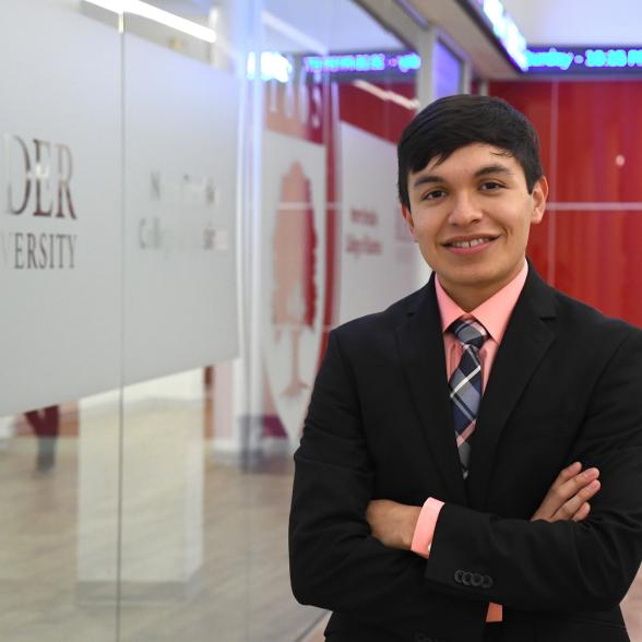 Business student in front of data analytics lab