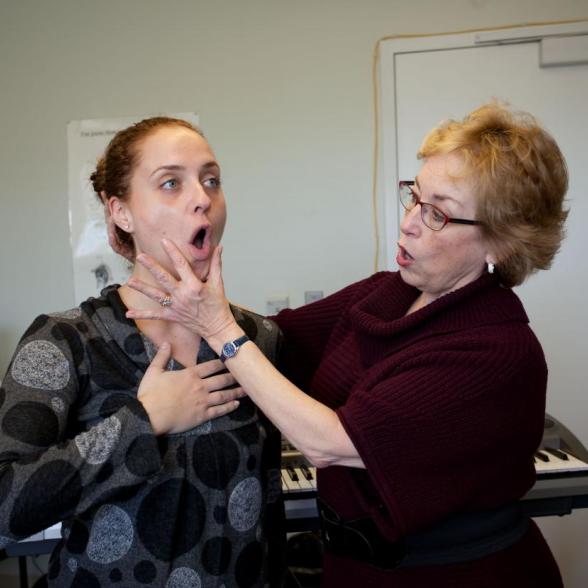 Faculty member opens student's vocal chords in presser voice lab