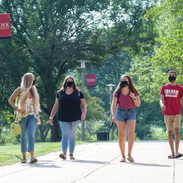 Students in masks walk to BLC