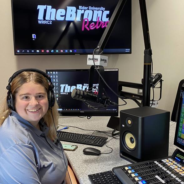Student works in the 107.7 The Bronc radio station