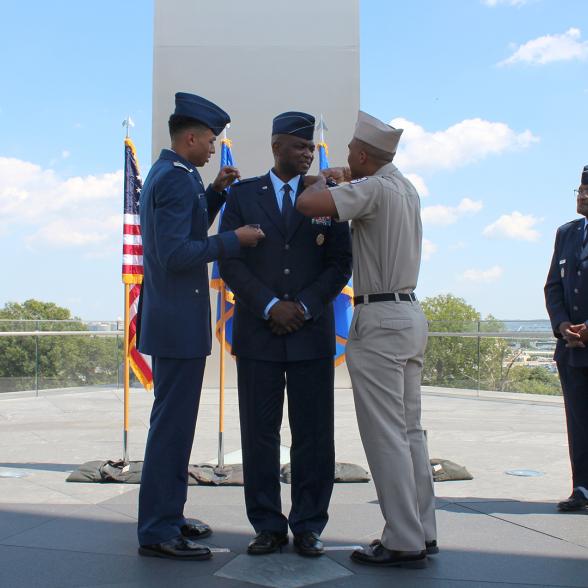 Brig. Gen. Alfred K. Flowers, Jr. (center), Air Force Medical Service Manpower, Personnel and Resources director, gets his brigadier general rank pinned