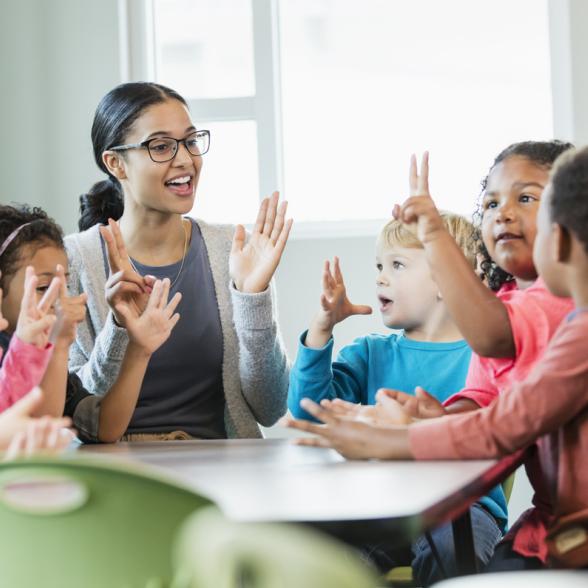 Teacher engages children with a game