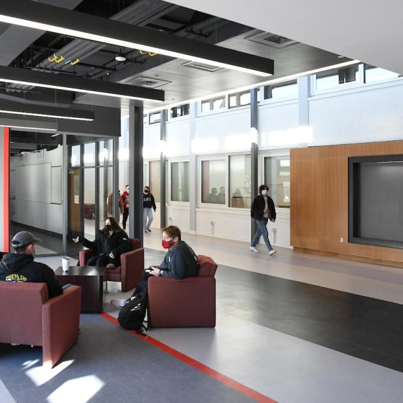 Students converse in the Science and Technology entryway