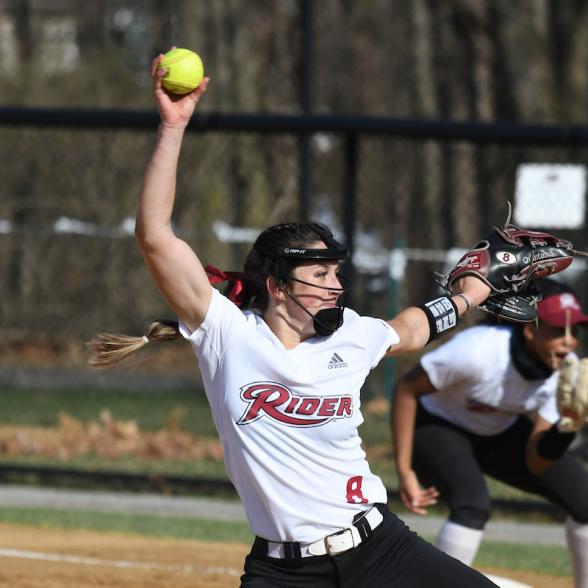 Women's softball player throwing ball