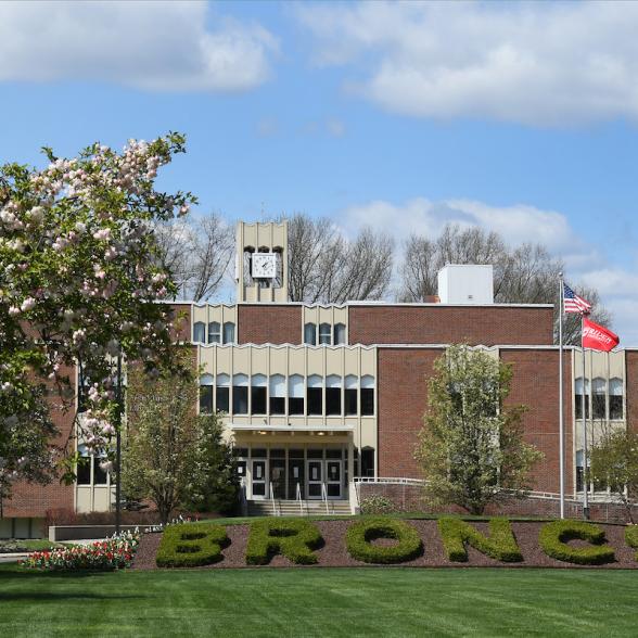Moore Library in spring with flowering trees