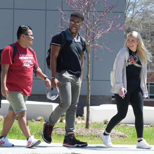 Student walking near science building