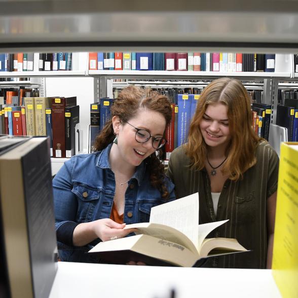 Students consult resources in Talbott Library