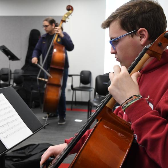 Students perform with strings