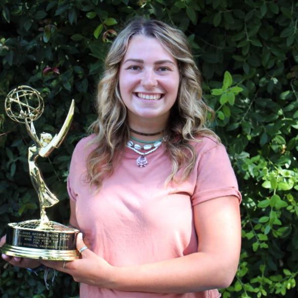 Kaylee Ettinger holding Emmy Award