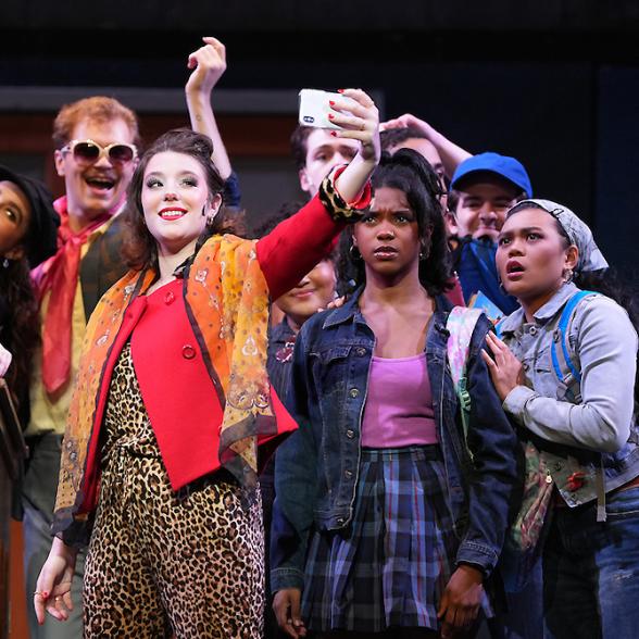 A group of students take a selfie in a scene from Rider's fall performance of The Prom