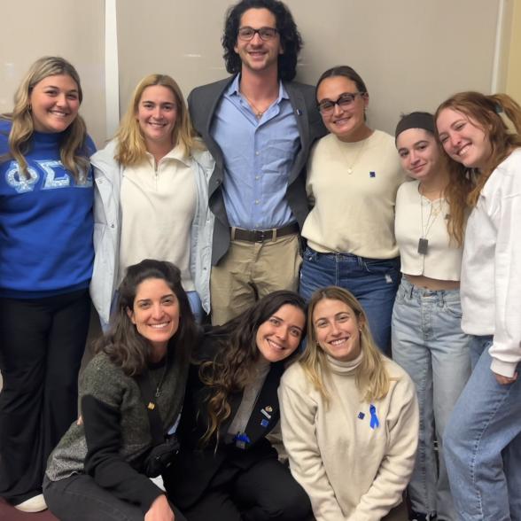 Hillel at Rider students pose with Eden Gefner