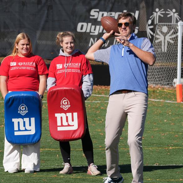Rider students and Eli Manning