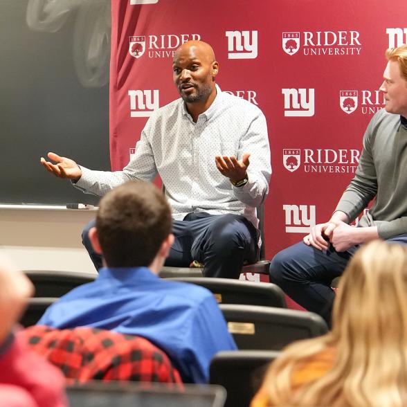 Amani Toomer speaking to Rider students